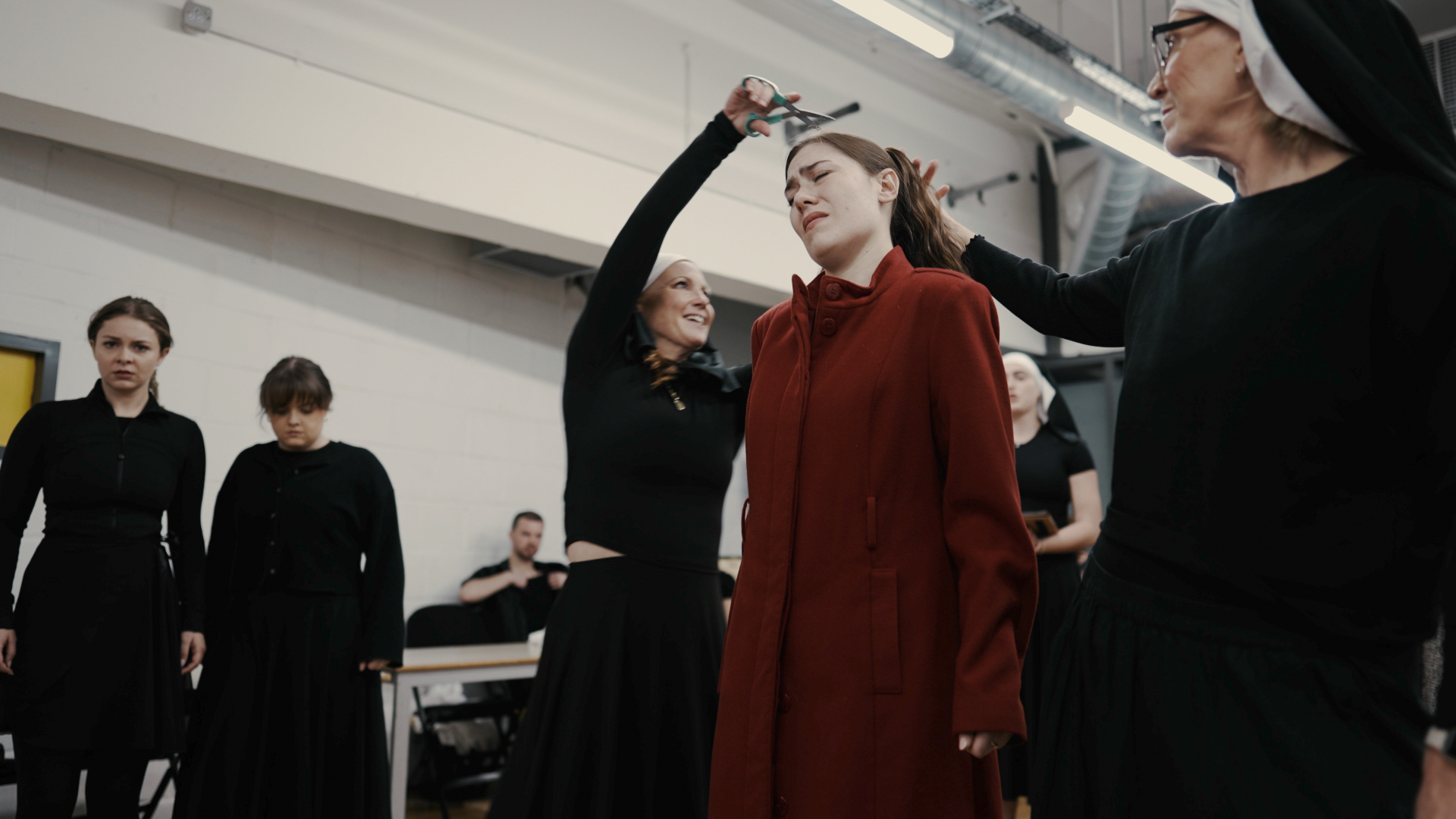 Hair cutting scene depicting the laundry rituals